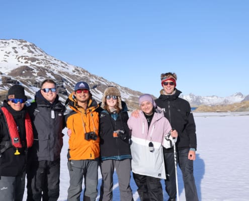 Inspiring Explorers Porohu Hagai Noa, Lawrence Rothwell, Sasha Cheng, Kelsey Waghorn, Destiny Martin and Henry Conquer on the walk to Shackleton’s waterfall. Antarctic Heritage Trust South Georgia Inspiring Explorers Expedition