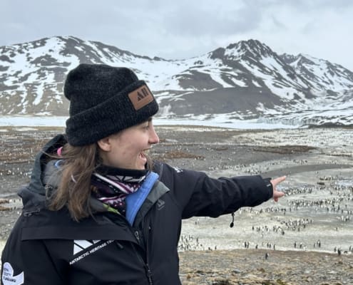 Rose Lasham taking in the sights and sounds of the St Andrews Bay king penguin rookery Inspiring Explorers Expedition South Georgia Antarctic Heritage Trust