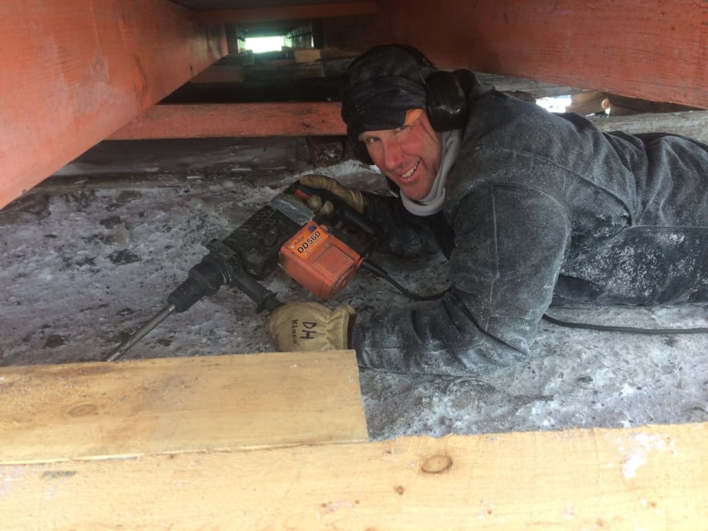 2016-17 AHT's Doug Henderson removing ice from underneath Hillary's TAE/IGY hut. ©AHT/Doug Henderson